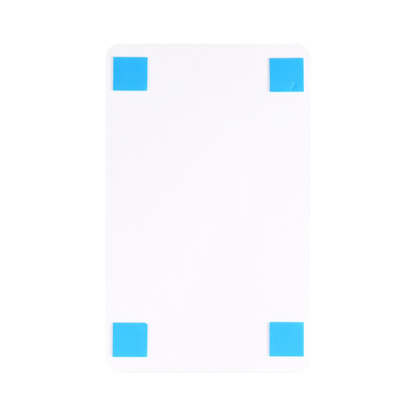 Back side of a restroom sign showing double-sided tape